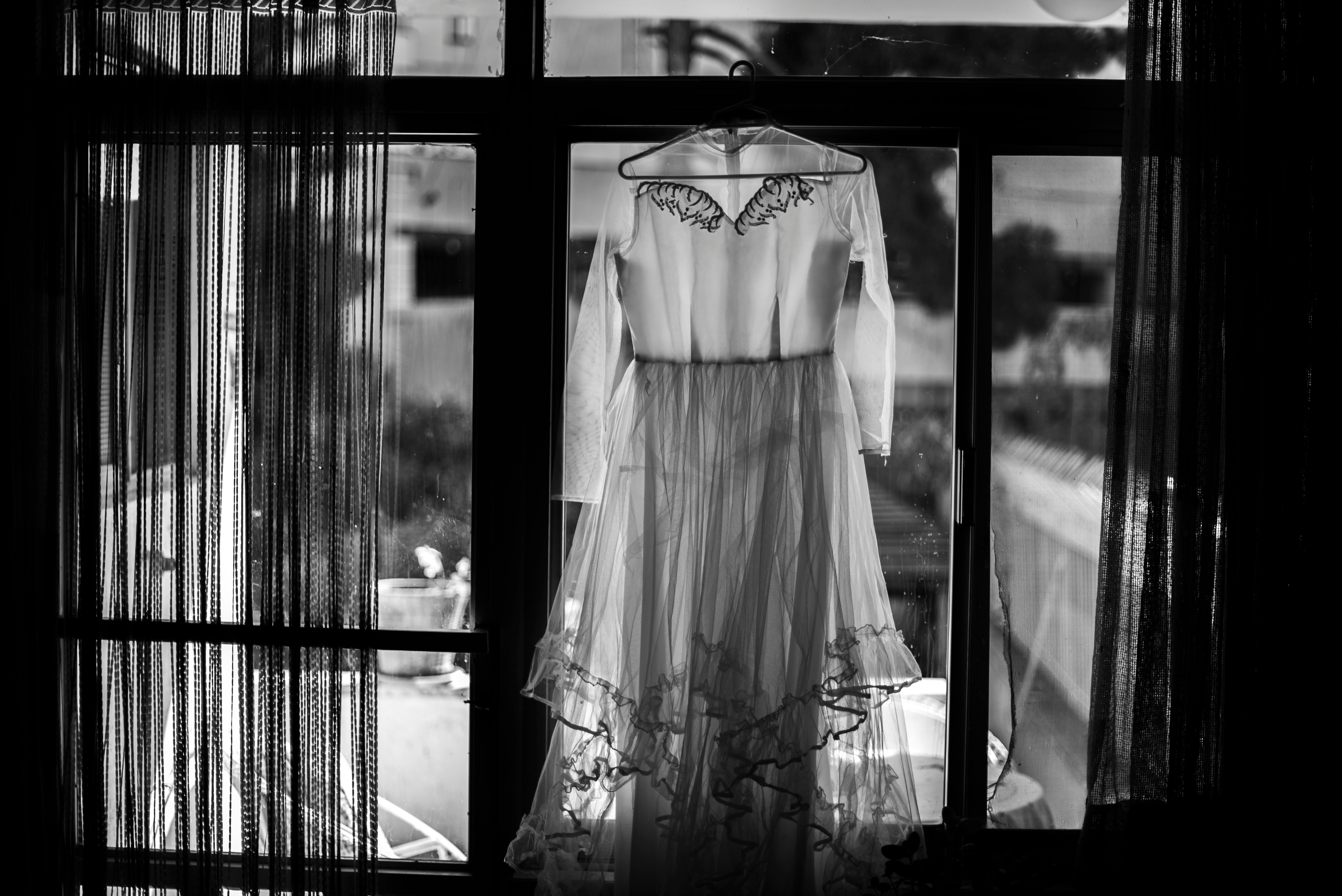 grayscale photography of dress hanging